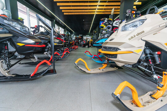 Rostov-on-Don, Russia - May 6, 2021: New BRP snowmobiles of 2022 model year with BRP Lynx and Ski-Doo logos set out for sale in showroom.
