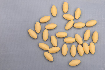 oval-shaped tablets lie on a contrasting background