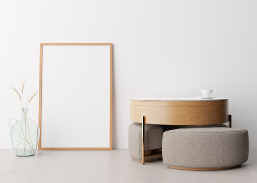 Empty vertical picture frame on white wall in modern living room. Mock up interior in minimalist, scandinavian style. Free space for picture. Wooden table, dried grass in glass vase. 3D rendering.
