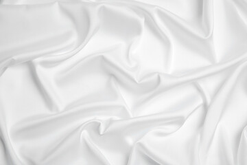 Fototapeta premium Texture of delicate white fabric as background, top view