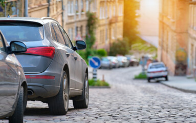 City traffic with cars parked in line on street side