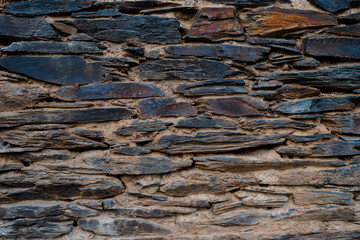 Stone and clay wall texture. Natural stone background.