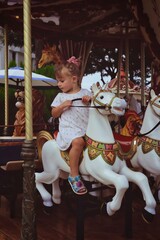 Fototapeta na wymiar child on carousel