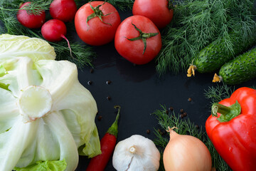 Fresh raw red fish, trout or salmon, cut slice on a stone plate on a black background. Preparing fresh red fish for baking or grilling or barbecue, for fried