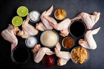 Chinese Five Spice Chicken Wings With Soy, Balsamic Reduction Glaze Ingredients: Overhead view of raw chicken wings with ingredients to make marinade and glaze