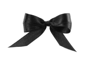 Elegant black ribbon tied in bow isolated on white, top view