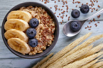 Whole grain oat meal with blueberries and banana slices
