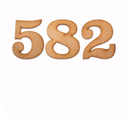 Number 582 in wood, isolated on white background