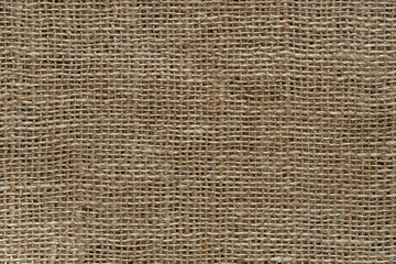 Burlap fabric texture macro. Background of coarsely woven sackcloth from jute, hemp or flax. Design...