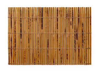 Speckled bamboo table mat isolated on a white background. Textured surface of brown wooden luncheon...