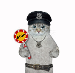 An ashen cat cop in a black hat with a police badge around his neck holds a stop sign. White background. Isolated.