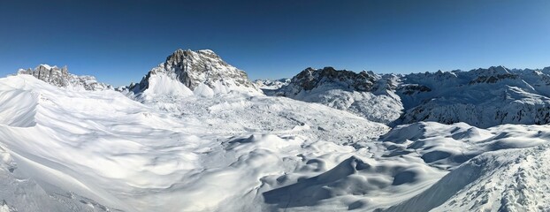 Ski tour in the swiss mountains. Mountaineering in winter. Skimo on the Sulzfluh near St.Antonien.Sun mountains and snow