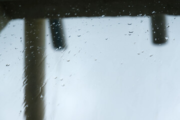 Rain water discharging out of the gutter. Rainwater drainage, minimalist and simple concept. Copy...