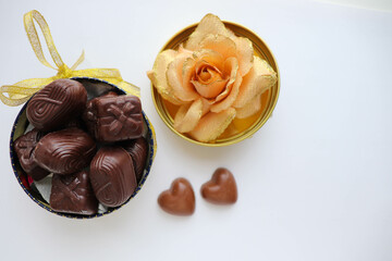 sweet gift for valentine's day. small gift box, red heart and chocolates 