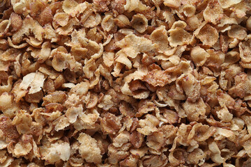Buckwheat flakes top view background close up