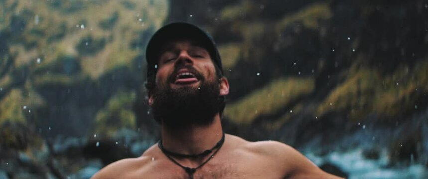 Man extends toungue to feel drobs of rain
