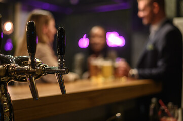 Close shot of beer tap in a bar