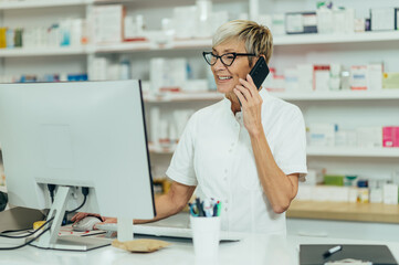 Portrait of a beautiful senior female pharmacist working in a pharmacy