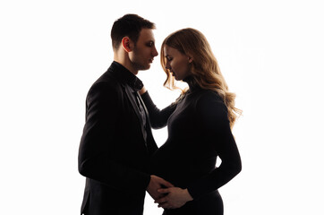 Beautiful pregnancy of a young family. Pregnant woman and man on a white background. Happy couple