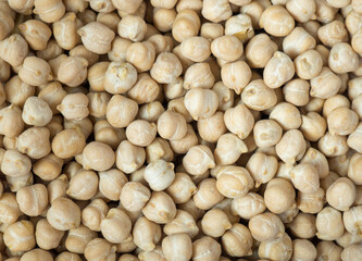 Dry chickpea background, top view. Background of chickpea seeds, close-up.