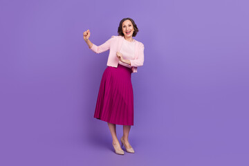 Full length photo of cheerful excited lady enjoy free time weekend clubbing isolated on purple color background