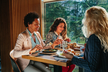 Three business women having lunch break