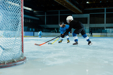 Ice hockey practice session on indoor rink