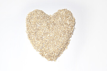 Background, oatmeal, scattered, in the form of oatmeal heart, healthy diet food