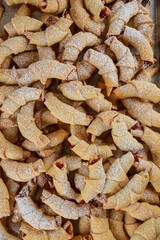 Close up of baked crescent cookies with jam.