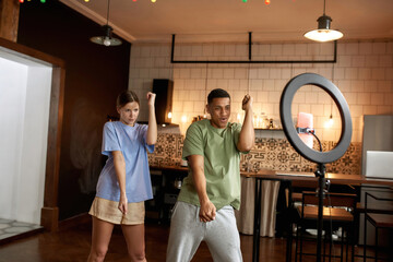 Couple making video challenge on mobile phone