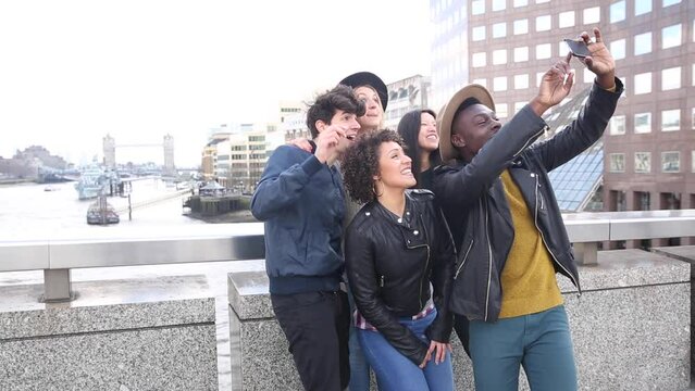 Multiracial group of friends taking a selfie together in London