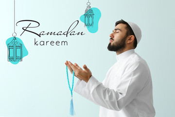 Praying Muslim man with tasbih on light background. Ramadan celebration