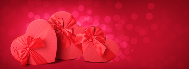 Gifts for Valentine's Day on red background with space for text