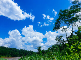 Panoramic view of famous Progo river with beautiful on a sunny day with blue sky in summer, Central Java, Indonesia, Asia.