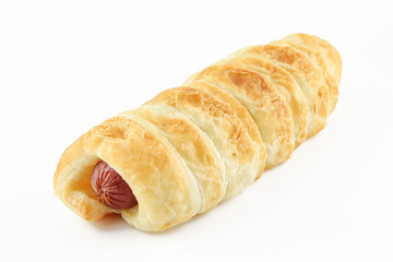 Hot dog stuffed pastry isolated on white background. Golden color dough