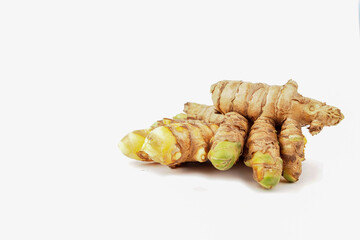 Fresh turmeric (Curcuma) rhizome on white background. herbal