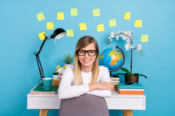 Portrait of attractive cheerful girl studying home comfort place homework isolated over vibrant blue color background