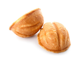 Halves of tasty walnut shaped cookies on white background