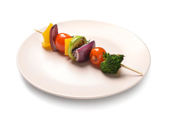 Plate with tasty vegetable skewer on white background