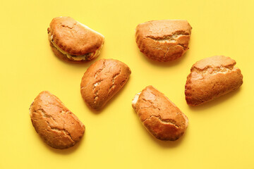 Tasty sochniki with cottage cheese on yellow background