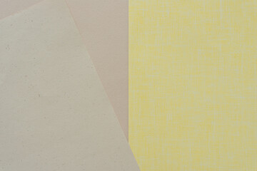 yellow and beige paper background (top down view) with blank space
