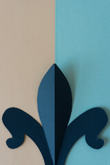 paper finial in dark blue with texture on beige and sky blue