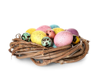 Nest with colorful Easter eggs on white background