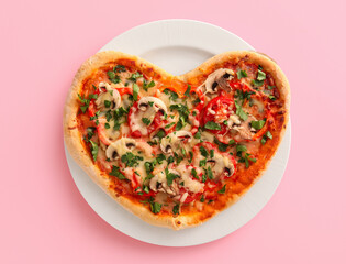 Plate with tasty heart-shaped pizza on pink background. Valentine's Day celebration