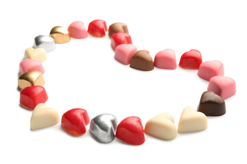 Heart made of chocolate candies on white background
