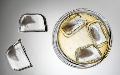 Ice with drink on table from low angle