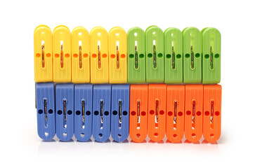 Closeup image of little colorful office clothespins isolated on a white background