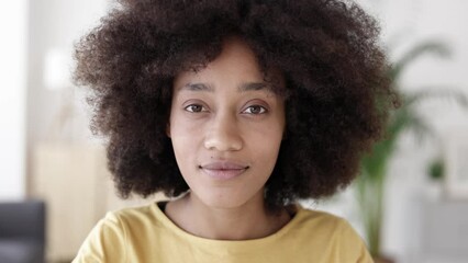 POV young african american woman listening and looking at camera through video call on laptop - Portrait african female participant on video chat online. High quality 4k footage - Powered by Adobe