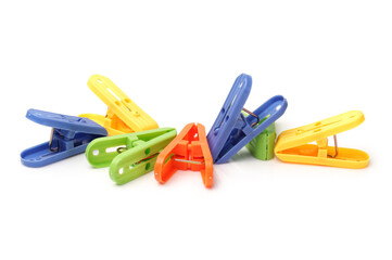 Closeup image of little colorful office clothespins isolated on a white background
