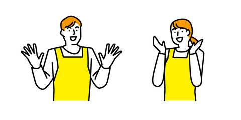 両手をあげて驚き喜ぶエプロン姿の男性と女性